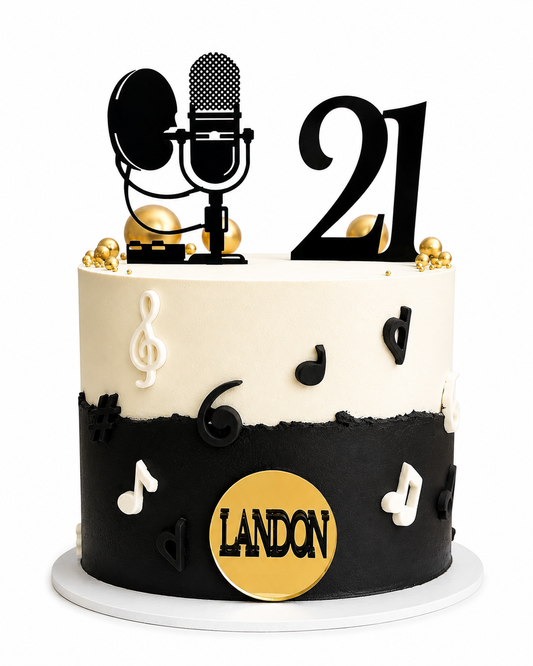 Tall 21st celebration cake decorated with musical notes and gold detail