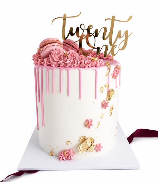 White and pink 21st birthday cake with a gold acrylic topper and edible gold leaf