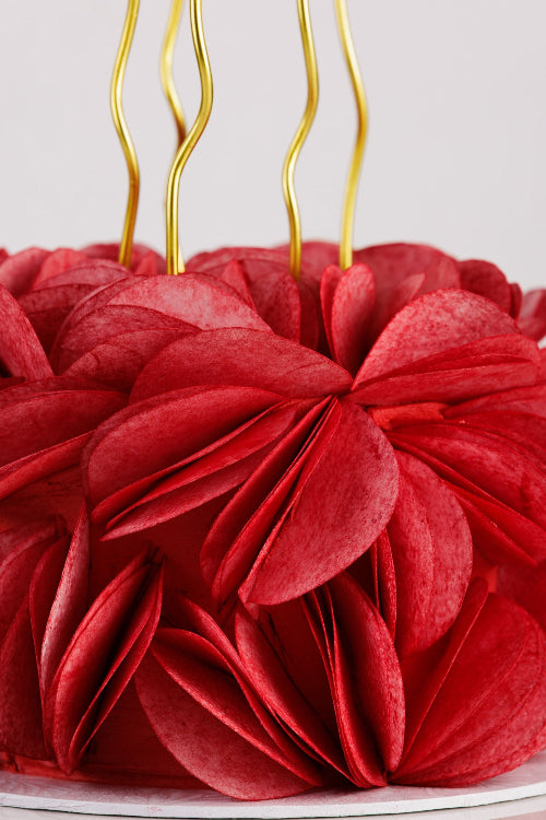 Celebration cake wrapped in sculpted wafer paper petals