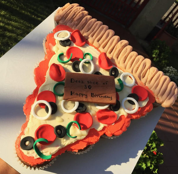 Cupcakes decorated to look like slices of pizza